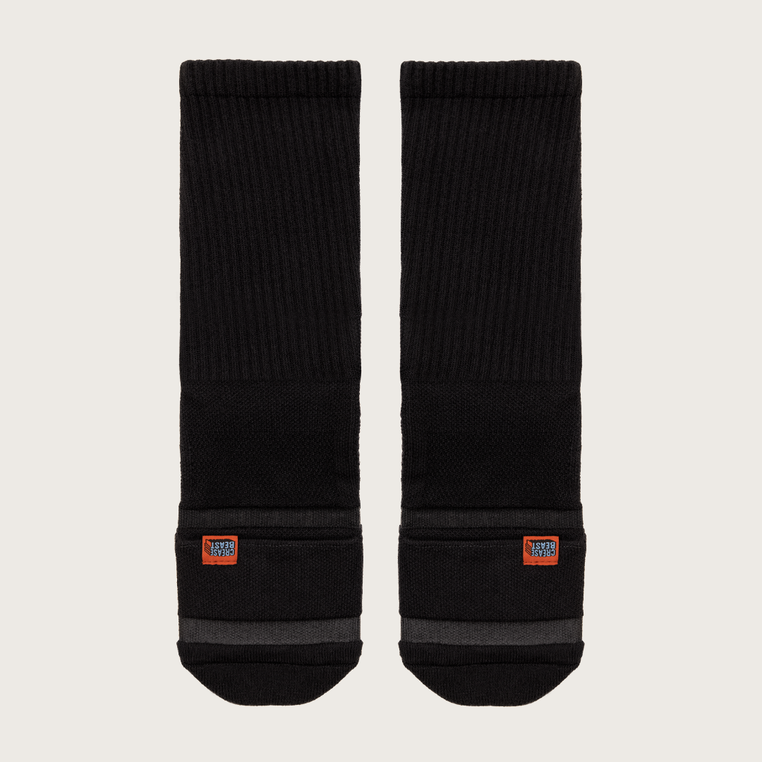 Flat Lay Of Crease Beast Black Socks – Comfort & Durability 